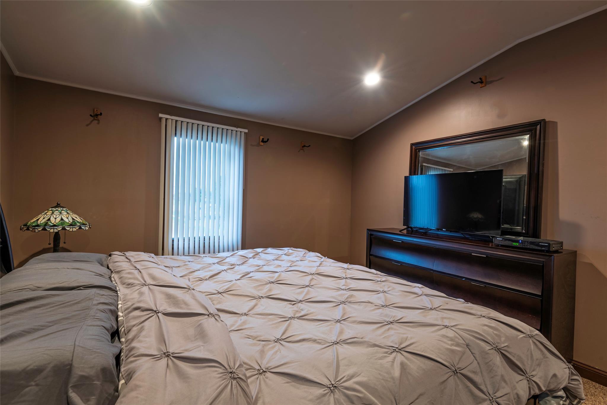 22 Lowland Road Levittown, NY 11756 - Photo 16 of 38 Bedroom featuring vaulted ceiling and ornamental molding