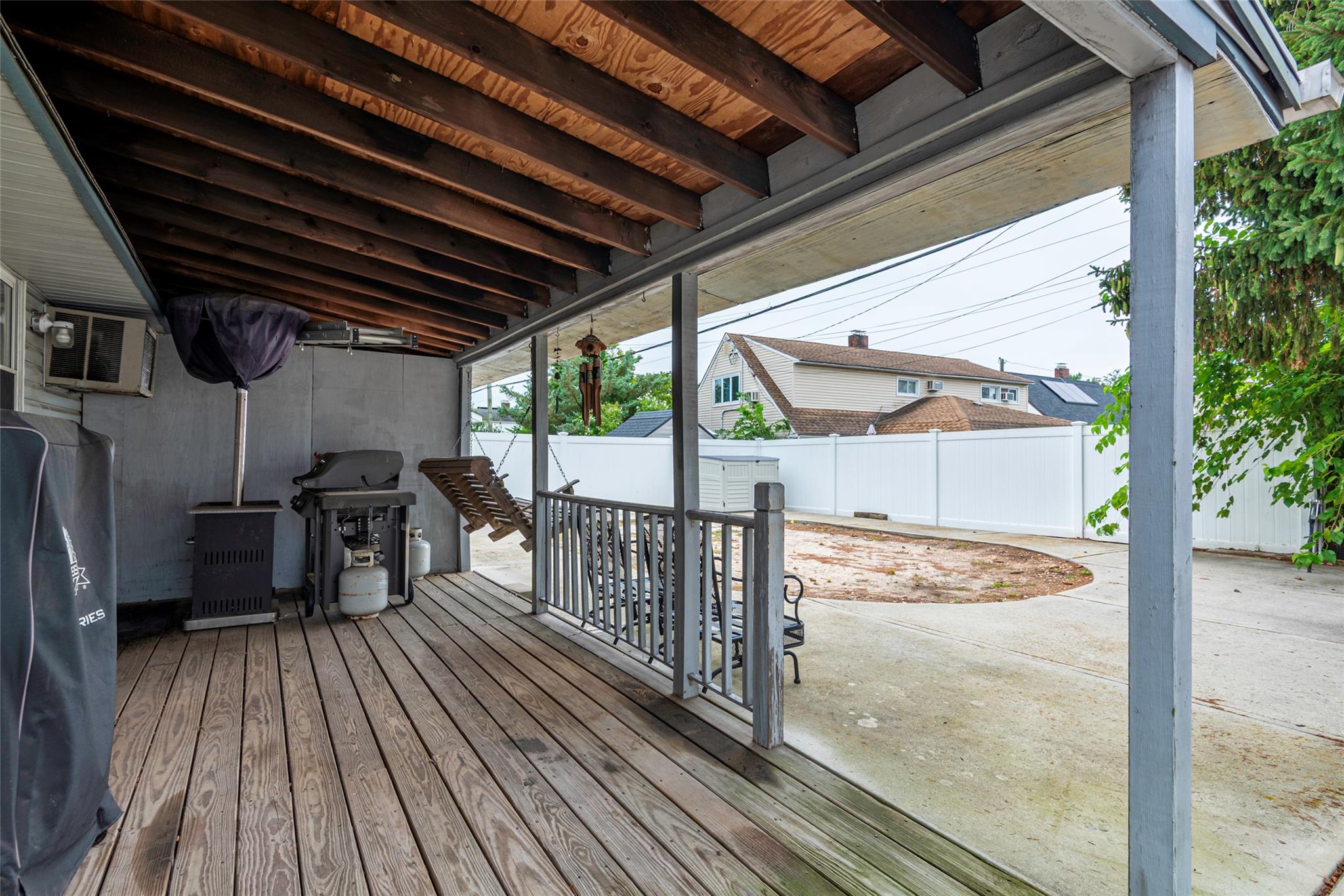 22 Lowland Road Levittown, NY 11756 - Photo 29 of 38 Wooden deck featuring a fenced backyard and a patio area