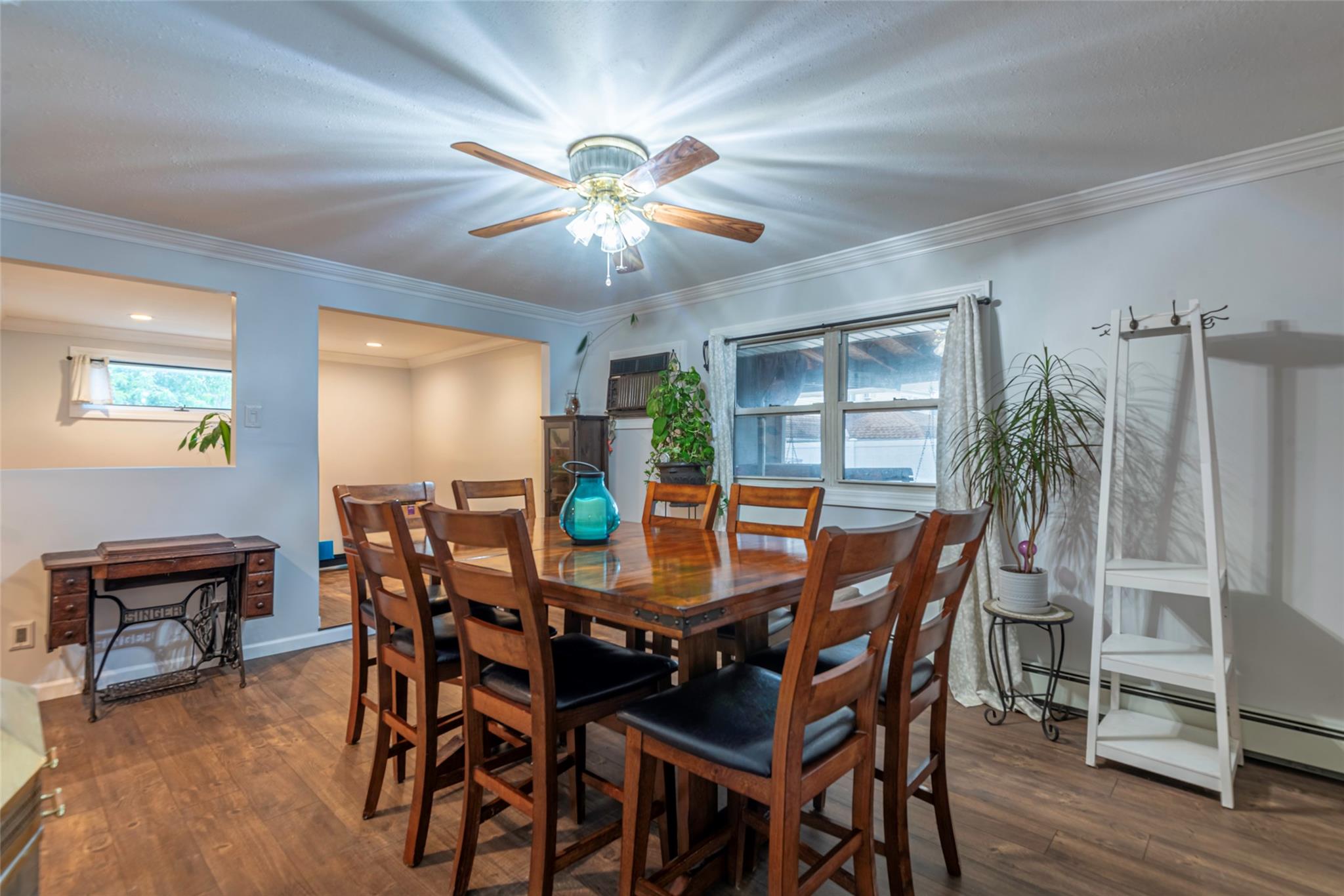 22 Lowland Road Levittown, NY 11756 - Photo 9 of 38 Dining area featuring ornamental molding and wood finished floors