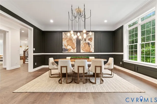 a living room with furniture and large windows