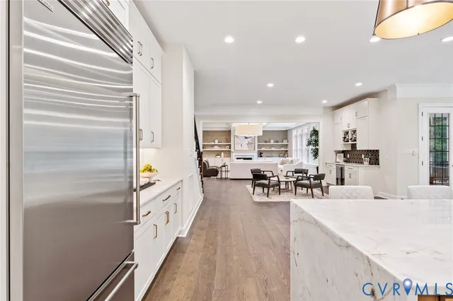 a bathroom with a double vanity sink and mirror with window