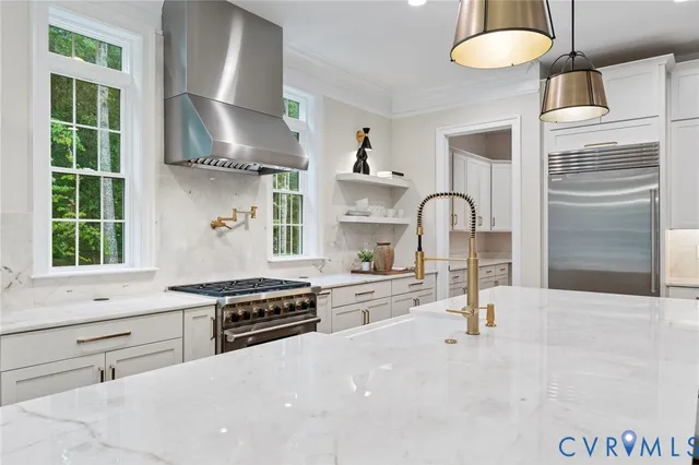 a white bath tub sitting next to a white sink