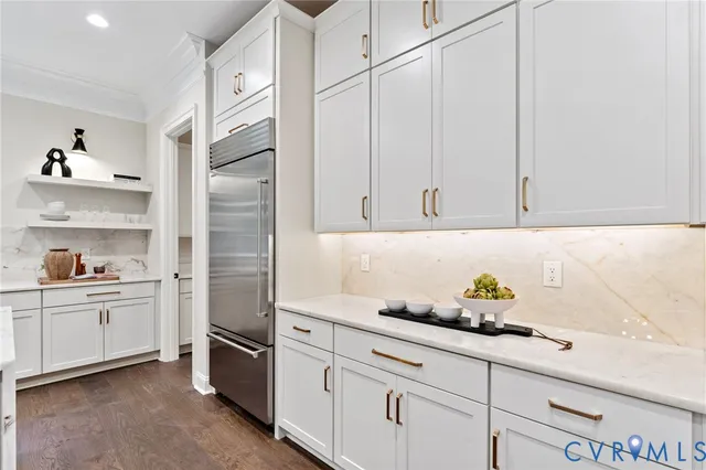 a spacious bedroom with a bed and a large window