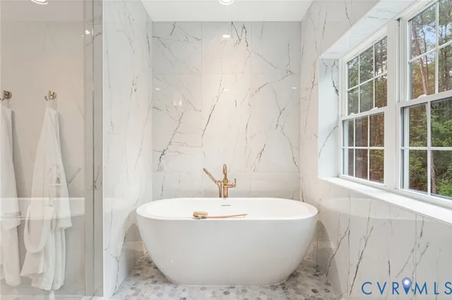 a bathroom with a sink a toilet and a bathtub