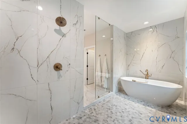 a view of a dining room with furniture large windows and wooden floor