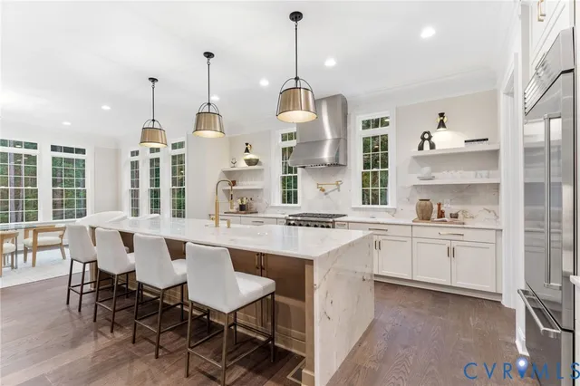 a living room with furniture a window and a fan