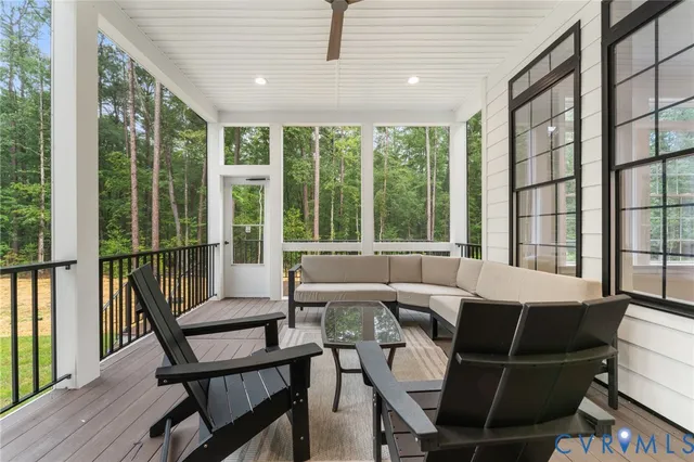 a kitchen with stainless steel appliances kitchen island granite countertop a refrigerator and a sink
