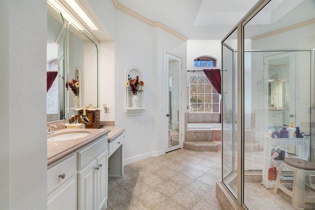 283 Butternut Lane Powderly, TX 75473 - Photo 13 of 32 a bathroom with a sink mirror and vanity