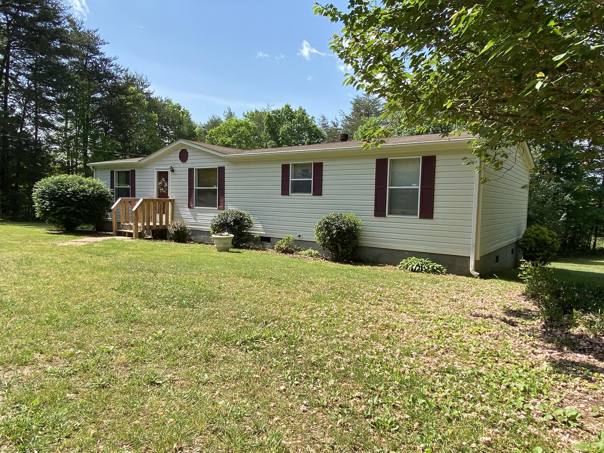 759 Briar Ridge Road Henry, VA 24102 - Photo 1 of 26 a front view of a house with yard and seating area
