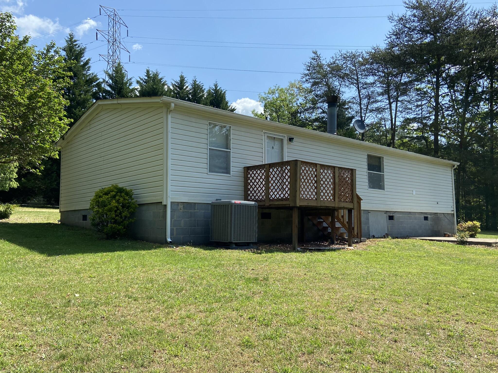 759 Briar Ridge Road Henry, VA 24102 - Photo 22 of 26 a front view of house with yard and green space