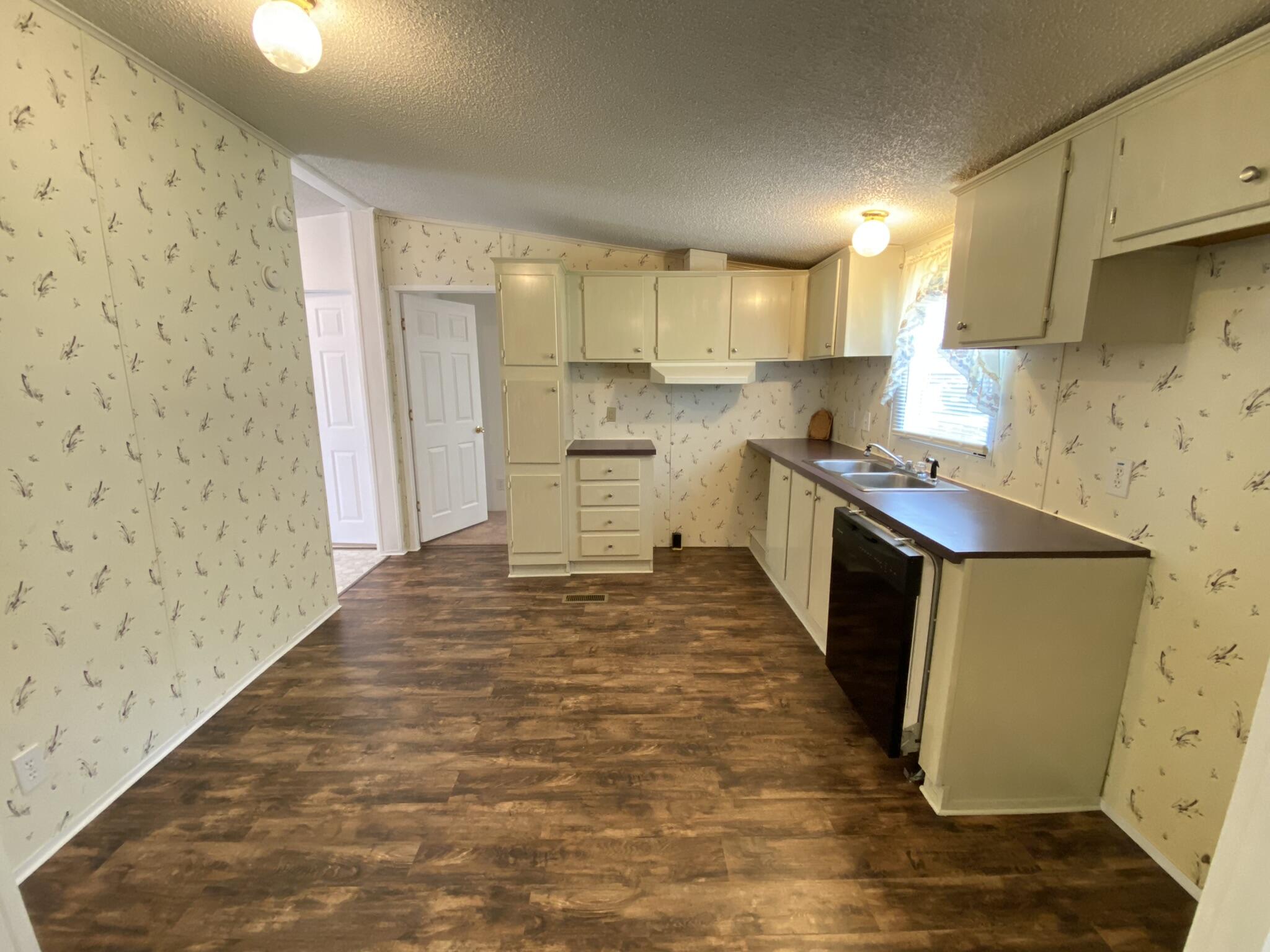 759 Briar Ridge Road Henry, VA 24102 - Photo 5 of 26 a kitchen with granite countertop cabinets a sink and a stove