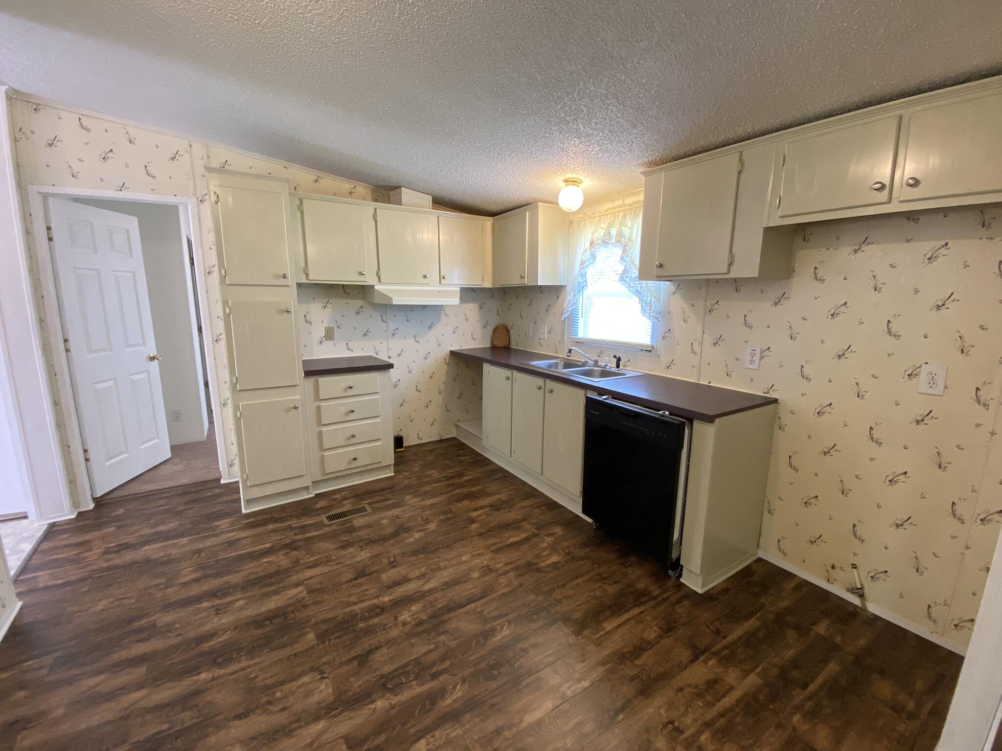 759 Briar Ridge Road Henry, VA 24102 - Photo 6 of 26 a kitchen with a sink cabinets and wooden floor