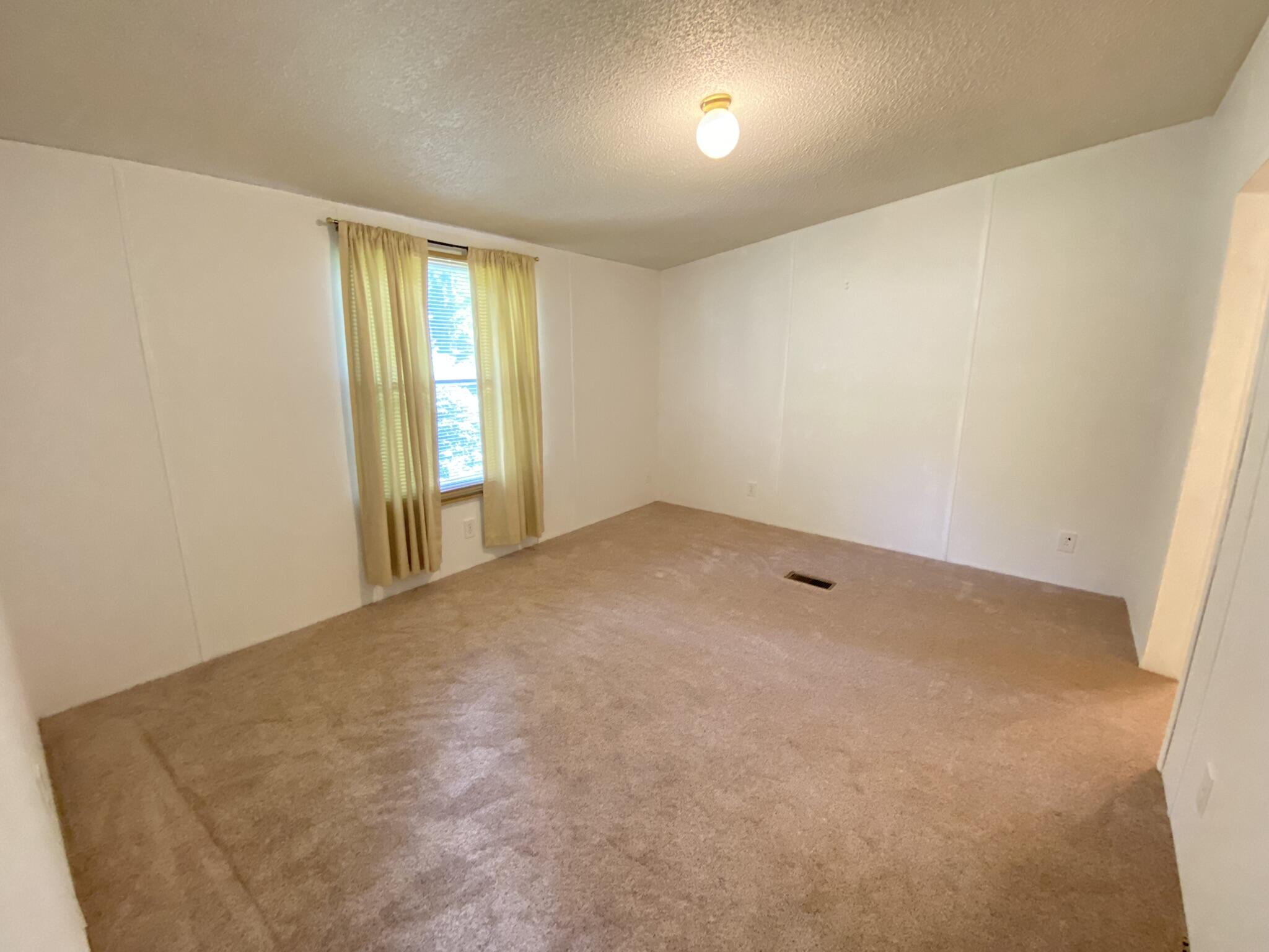 759 Briar Ridge Road Henry, VA 24102 - Photo 9 of 26 an empty room with windows