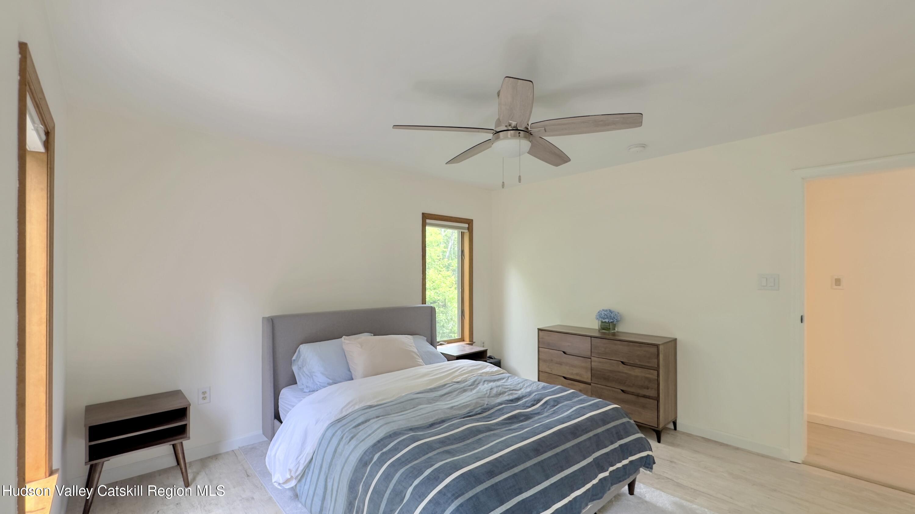3223 Sleepy Hollow Road Athens, NY 12015 - Photo 37 of 55 a bedroom with a bed and a window