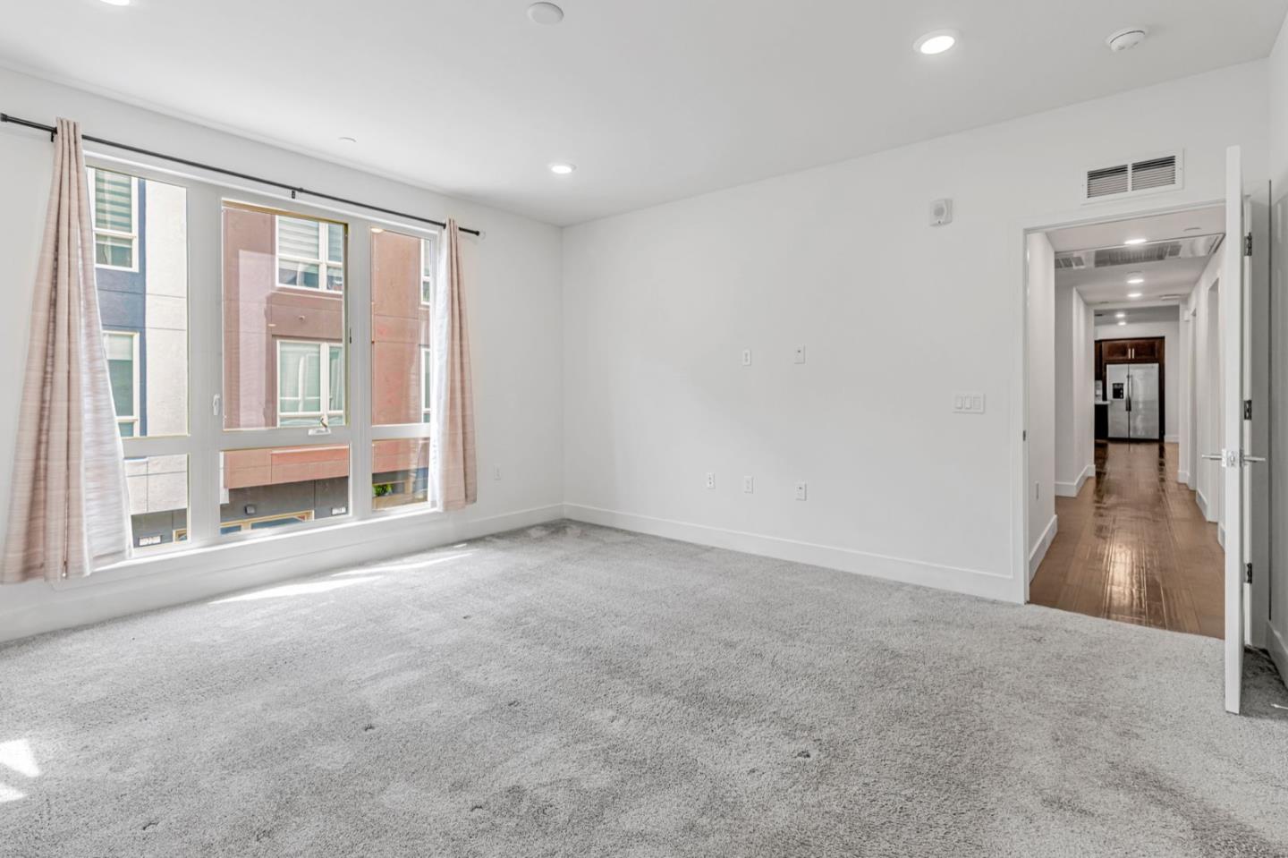 380 Riesling Avenue, Unit 21 Milpitas, CA 95035 - Photo 18 of 37 a view of an empty room with a window