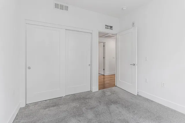 a view of a room with shelf on the wall