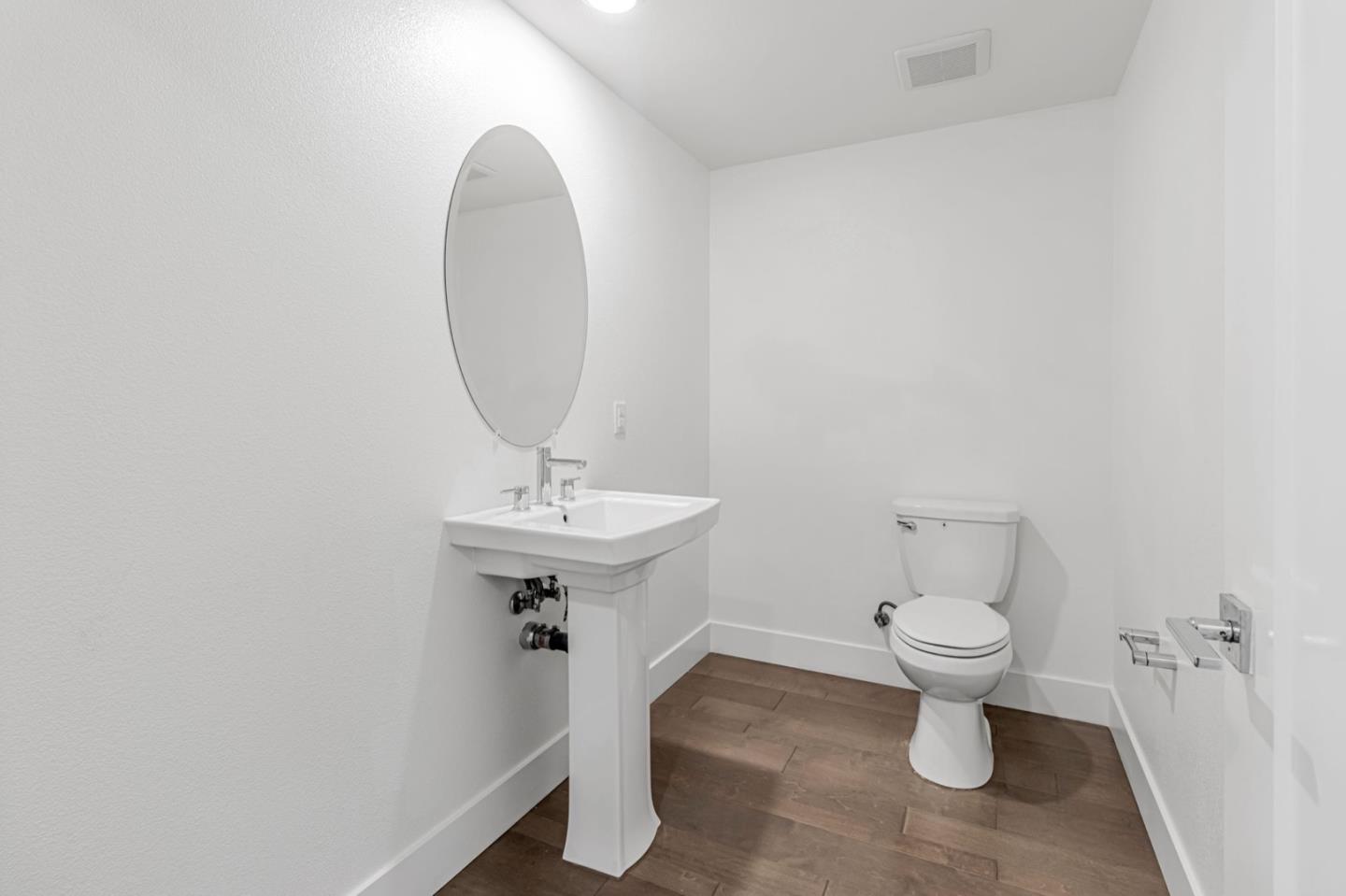 380 Riesling Avenue, Unit 21 Milpitas, CA 95035 - Photo 30 of 37 a bathroom with a sink toilet and a mirror