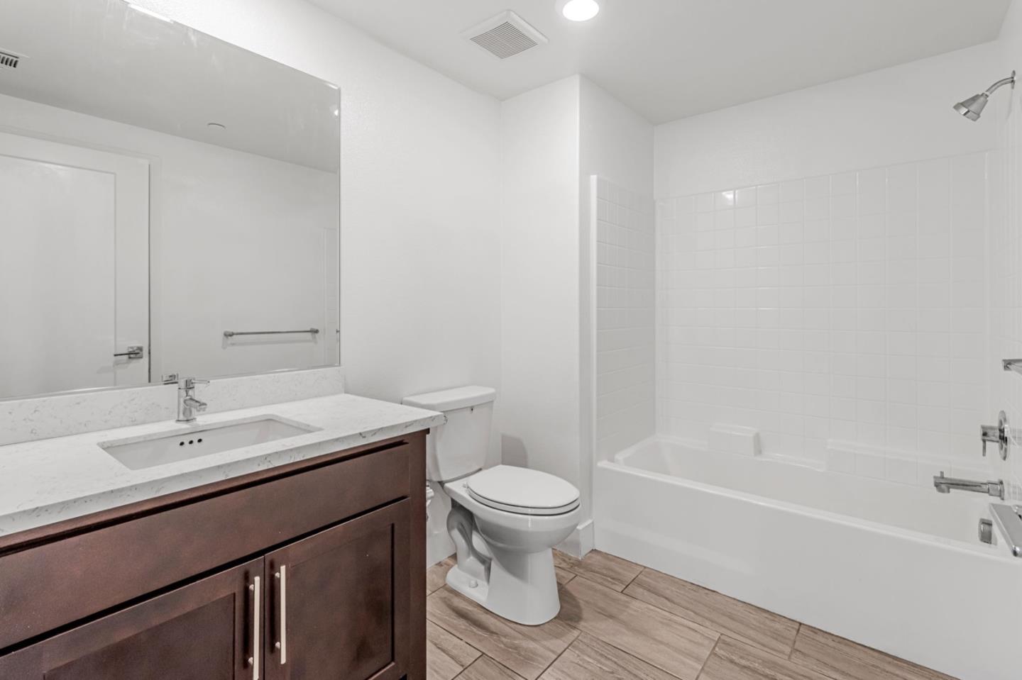 380 Riesling Avenue, Unit 21 Milpitas, CA 95035 - Photo 31 of 37 a bathroom with a sink a toilet and a bathtub