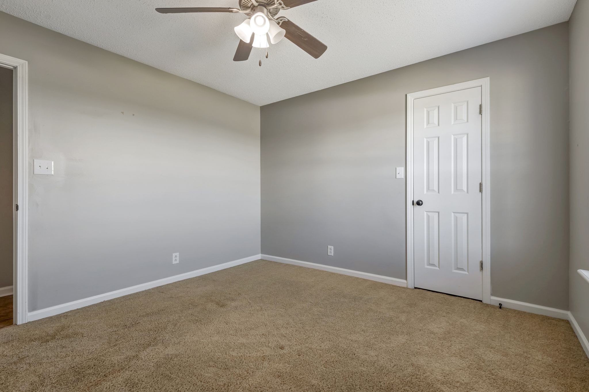 931 State Line Road Oak Grove, KY 42262 - Photo 14 of 24 an empty room with a chandelier fan