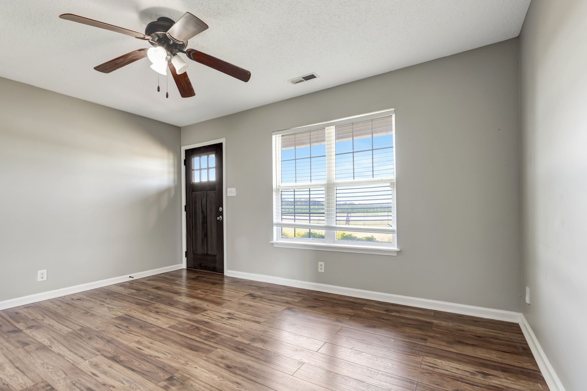 931 State Line Road Oak Grove, KY 42262 - Photo 7 of 24 a view of an empty room with window and wooden floor