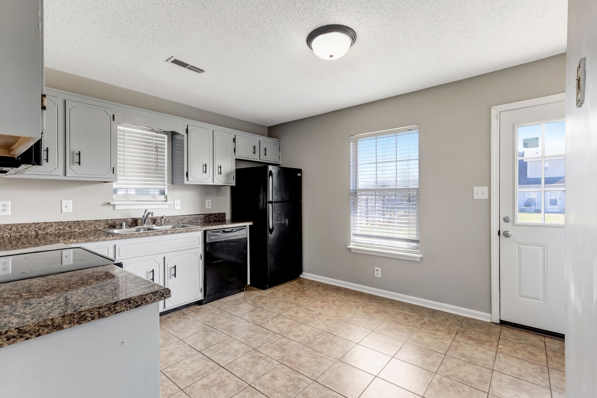 931 State Line Road Oak Grove, KY 42262 - Photo 8 of 24 a kitchen with a refrigerator stove top oven and sink