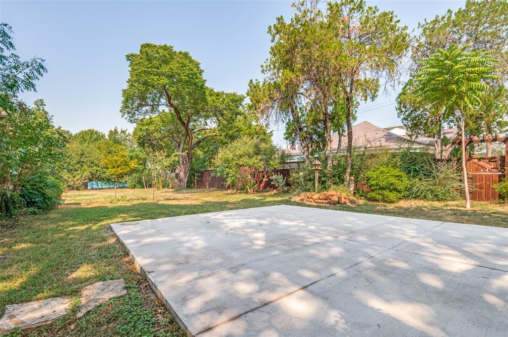 119 Archer Avenue Cockrell Hill, TX 75211 - Photo 4 of 8 a view of a yard with palm trees