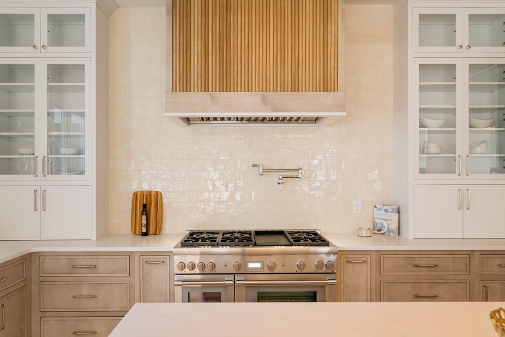 234 Valley Road Needham, MA 02492 - Photo 11 of 42 a stove top oven sitting inside of a kitchen
