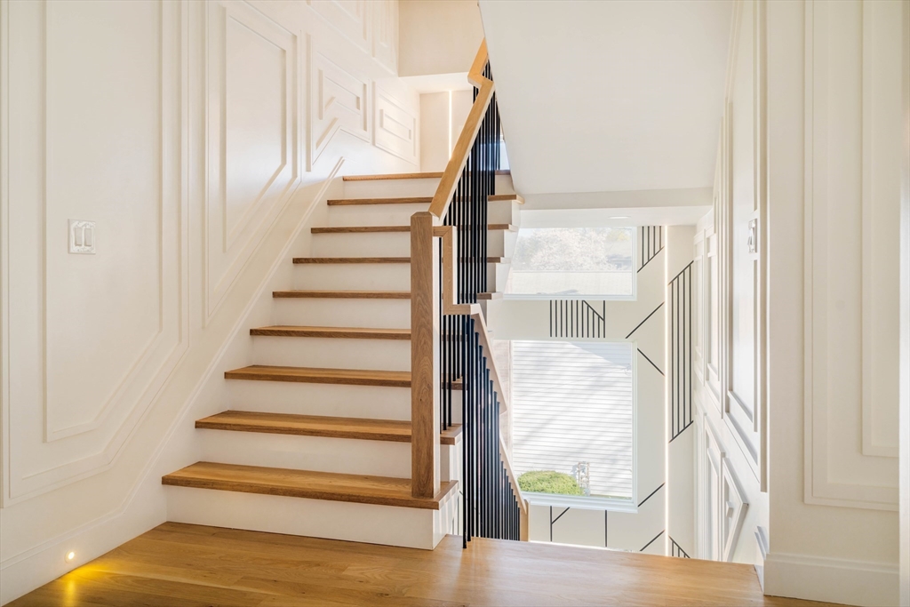 234 Valley Road Needham, MA 02492 - Photo 20 of 42 a view of entryway with wooden floor and front door