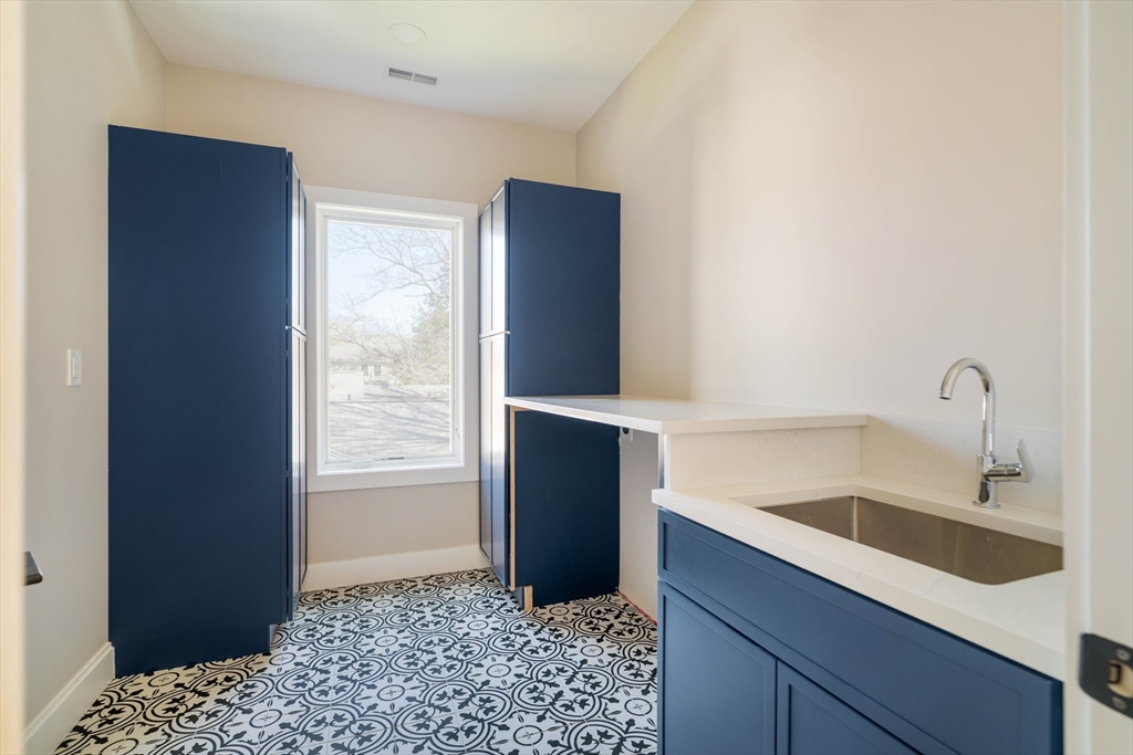 234 Valley Road Needham, MA 02492 - Photo 28 of 42 a bathroom with a sink and a bathtub