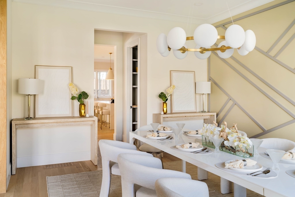 234 Valley Road Needham, MA 02492 - Photo 6 of 42 a dining room with furniture and wooden floor