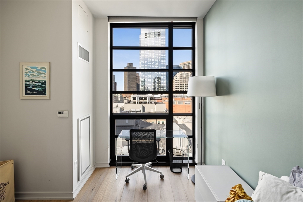 580 Washington Street, Unit PH5 Boston, MA 02111 - Photo 19 of 37 a view of a bedroom with furniture and window