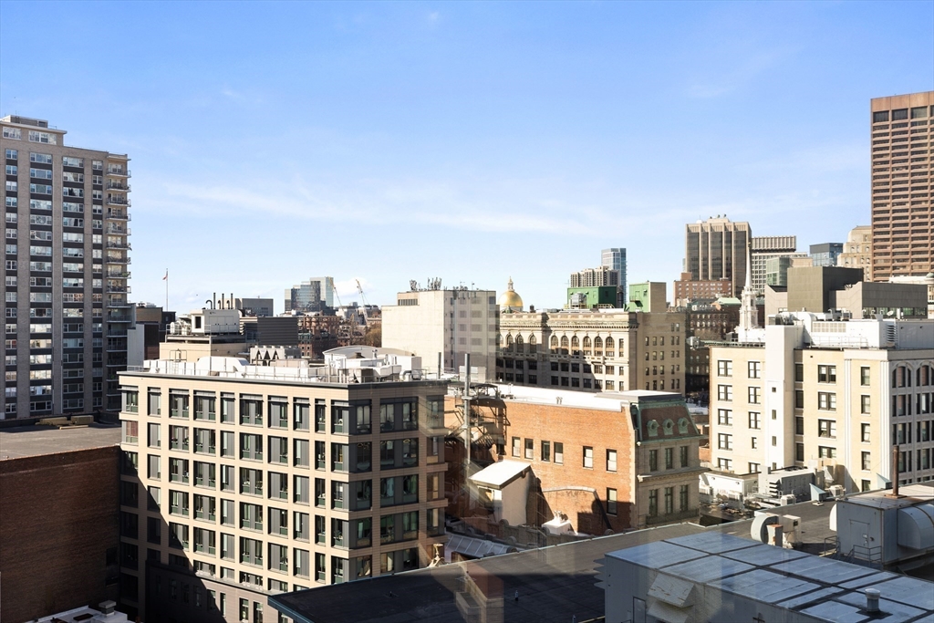 580 Washington Street, Unit PH5 Boston, MA 02111 - Photo 8 of 37 a view of a city that has tall buildings