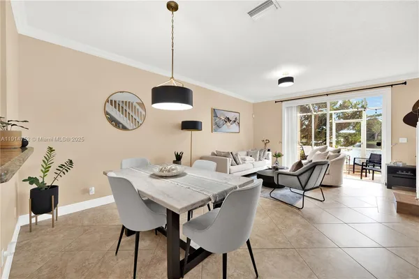 a view of a dining room with furniture