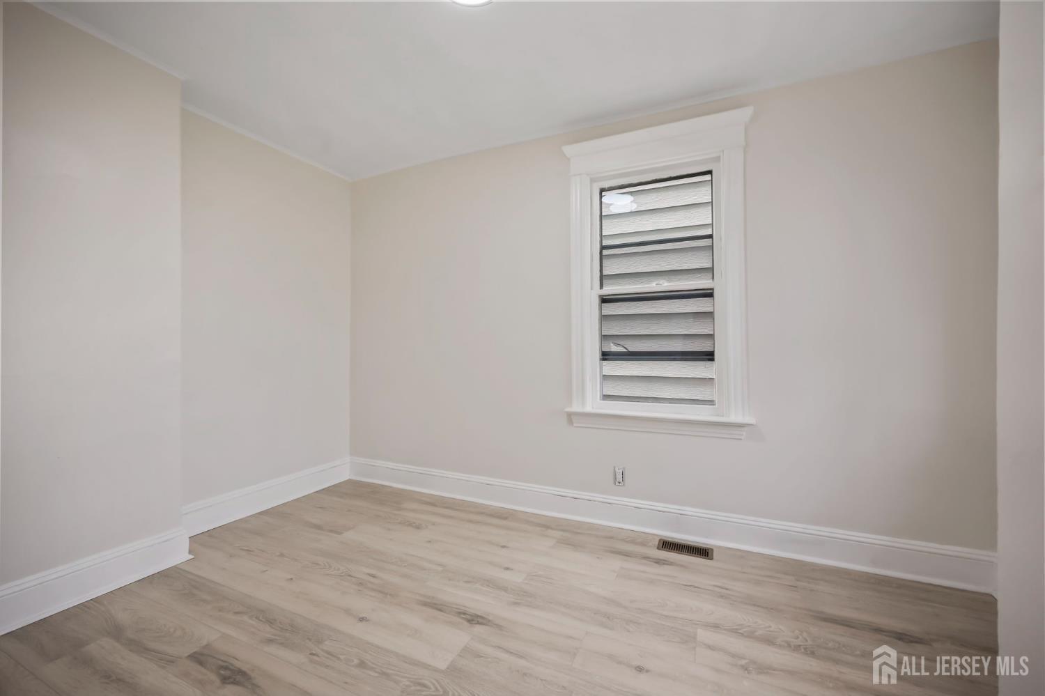 264 Barclay Street Perth Amboy, NJ 08861 - Photo 16 of 45 a view of a room that has a window in it