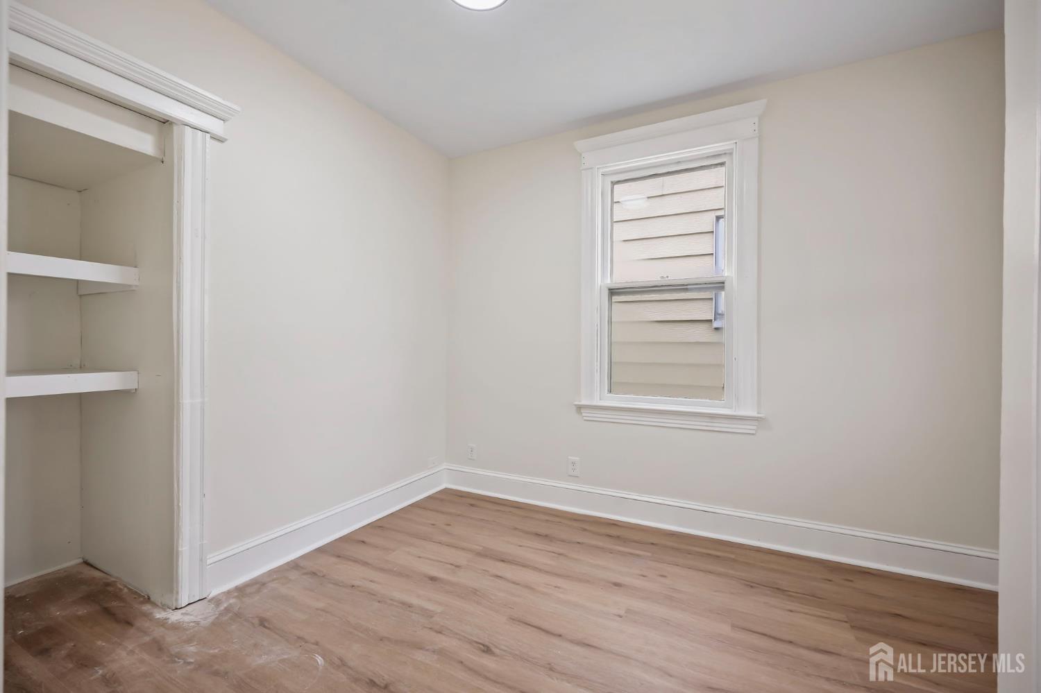 264 Barclay Street Perth Amboy, NJ 08861 - Photo 30 of 45 a view of a room that has a window in it