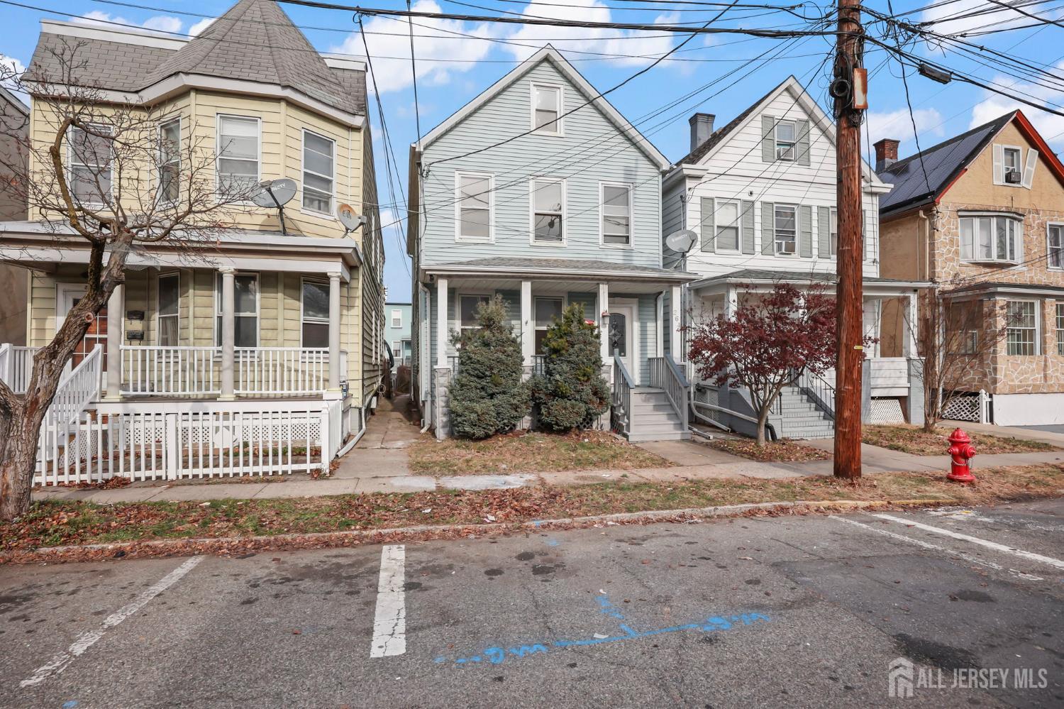 264 Barclay Street Perth Amboy, NJ 08861 - Photo 3 of 45 front view of a house with a yard