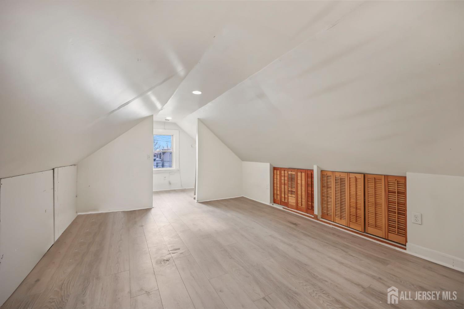 264 Barclay Street Perth Amboy, NJ 08861 - Photo 32 of 45 a view of an empty room with wooden floor