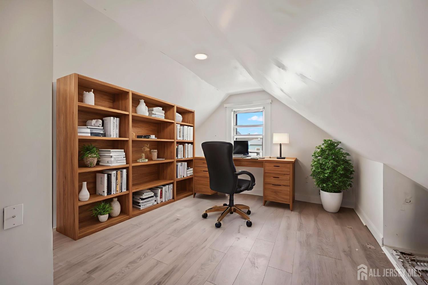 264 Barclay Street Perth Amboy, NJ 08861 - Photo 33 of 45 a view of a workspace with furniture and wooden floor