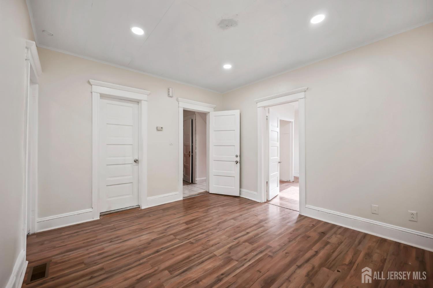 264 Barclay Street Perth Amboy, NJ 08861 - Photo 10 of 45 a view of an empty room with wooden floor