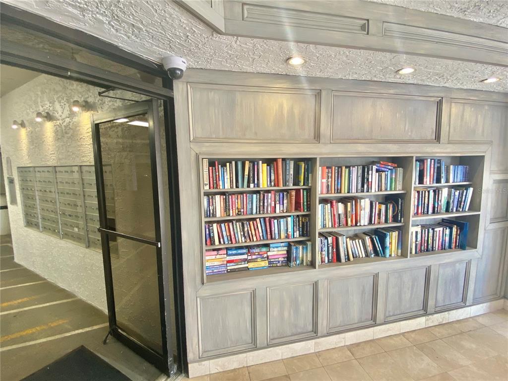 6035 Sea Ranch Drive, Unit 410 Hudson, FL 34667 - Photo 38 of 64 a view of a book shelf with cabinets