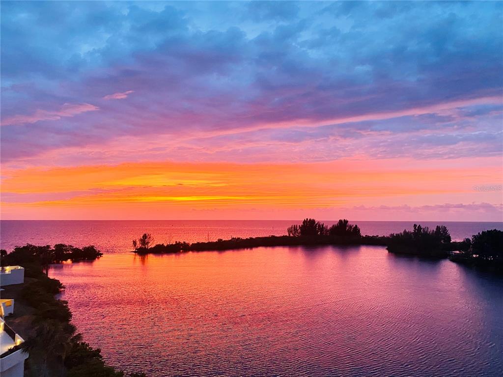 6035 Sea Ranch Drive, Unit 410 Hudson, FL 34667 - Photo 60 of 64 a view of lake and sunset