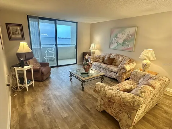 a living room with furniture and a rug