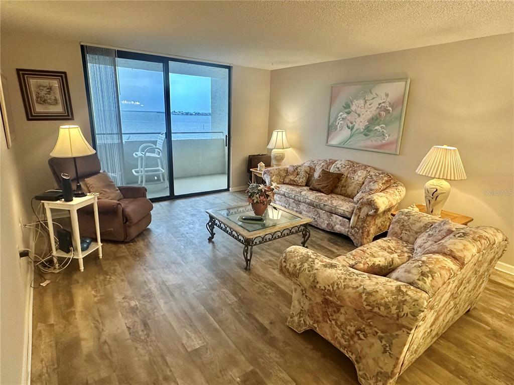 6035 Sea Ranch Drive, Unit 410 Hudson, FL 34667 - Photo 8 of 64 a living room with furniture and a window