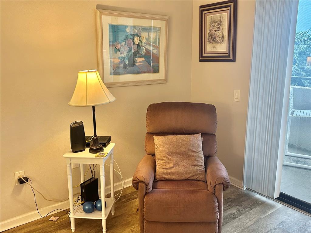 6035 Sea Ranch Drive, Unit 410 Hudson, FL 34667 - Photo 10 of 64 a living room with furniture and a fireplace