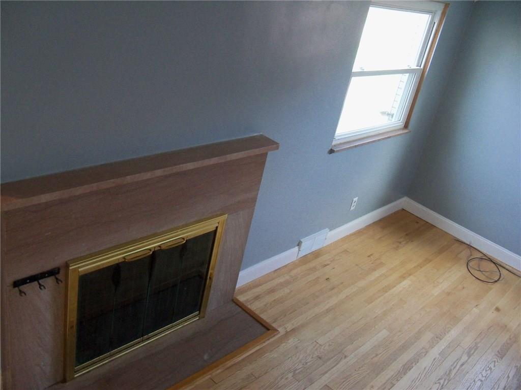 15 Ewing Road McKees Rocks, PA 15136 - Photo 4 of 23 Entertainment sized Living room with wood burning fireplace