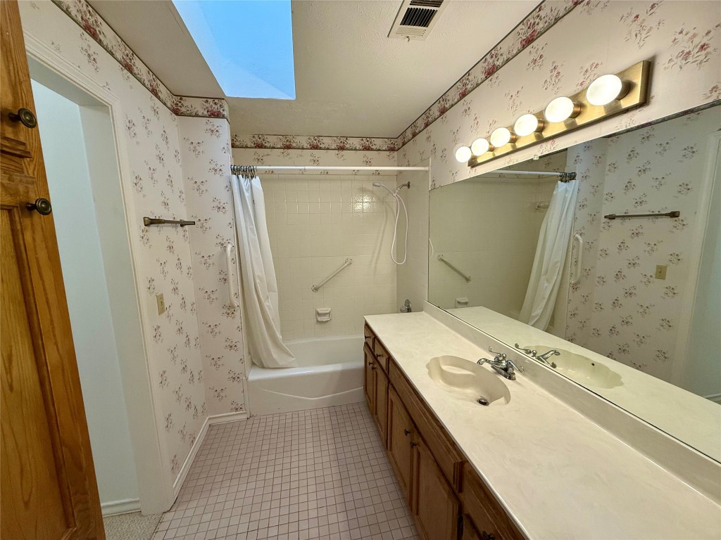 8 Stonehouse Circle Wimberley, TX 78676 - Photo 11 of 18 a bathroom with a sink a toilet and shower