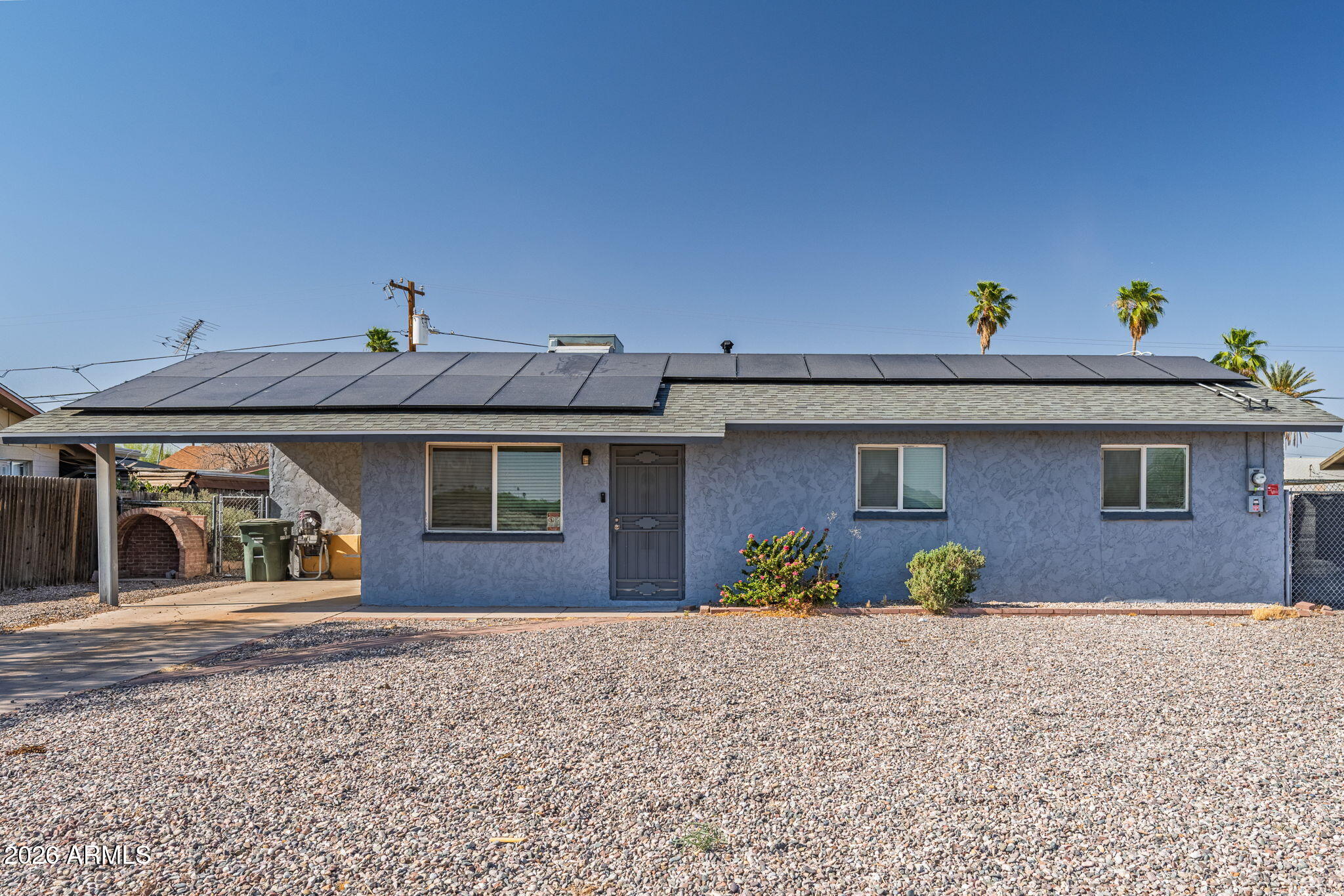 1268 East Rodeo Road Casa Grande, AZ 85122 - Photo 1 of 27 a view of a house with a yard and plants