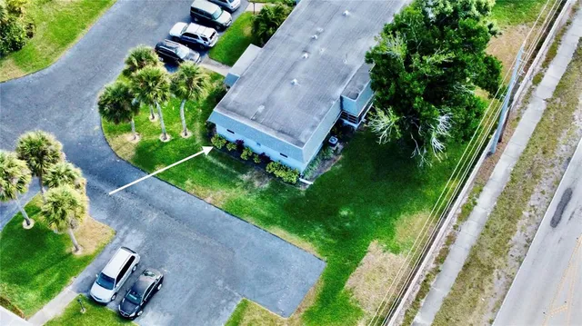 a room with lots of furniture and a view of a living room