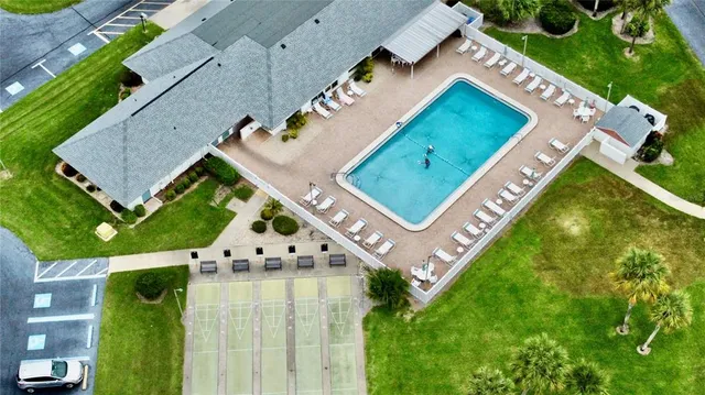 a large bathroom with a granite countertop double vanity sink a mirror and a shower