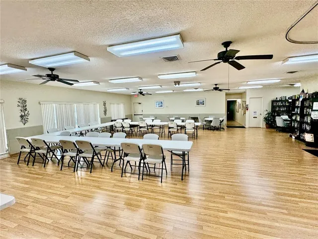 a kitchen with granite countertop a sink stove and cabinets